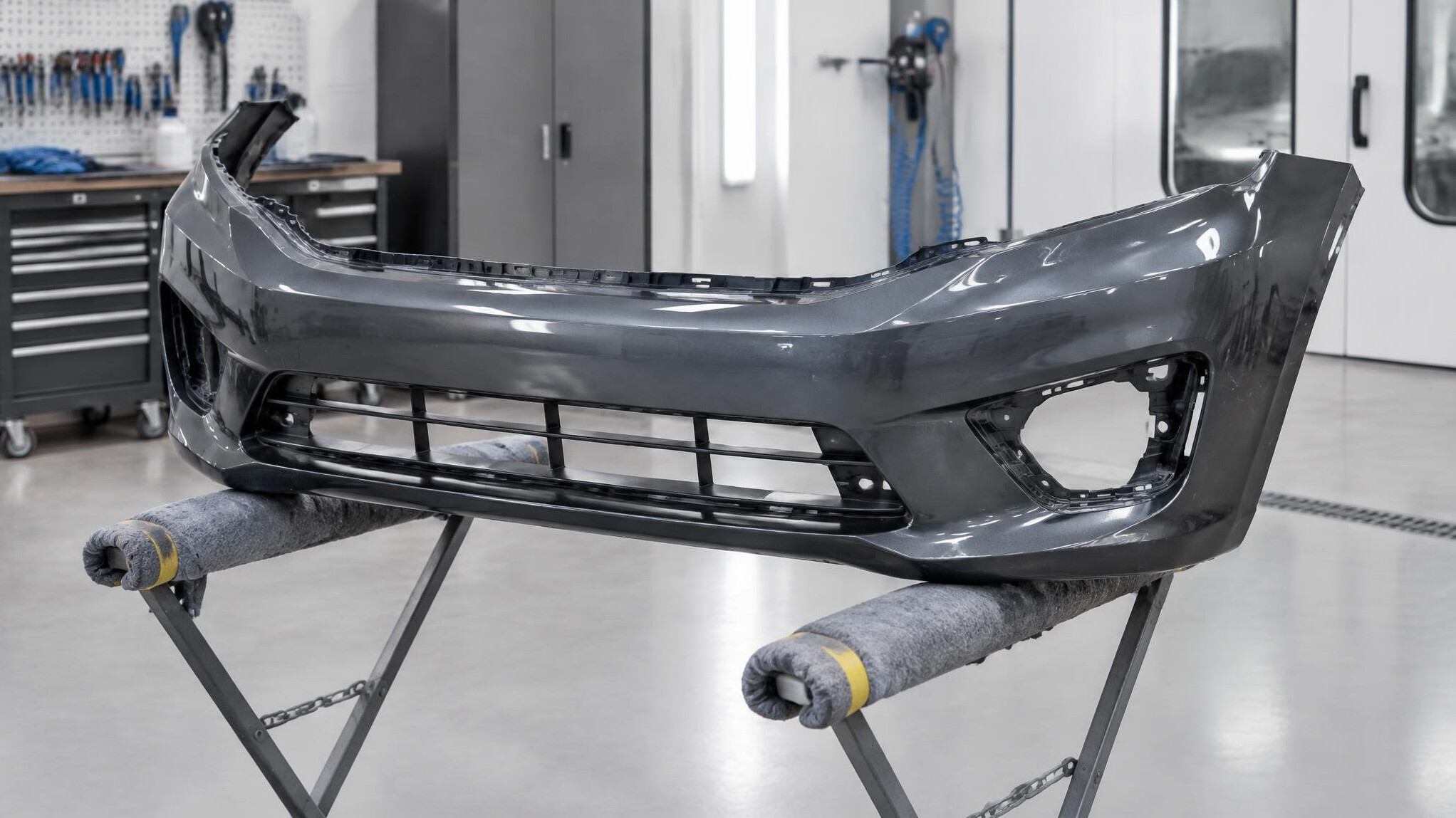 Plastic bumper being prepared for repair
