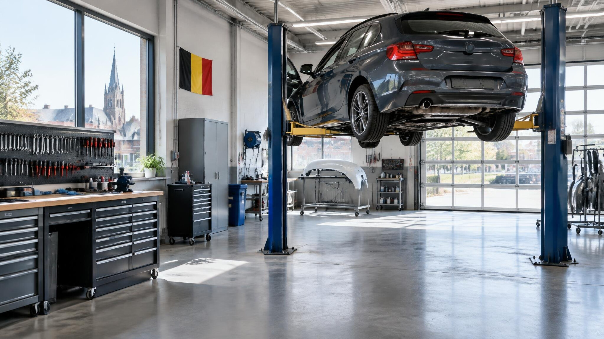 Car body repair workshop with a vehicle on a lift